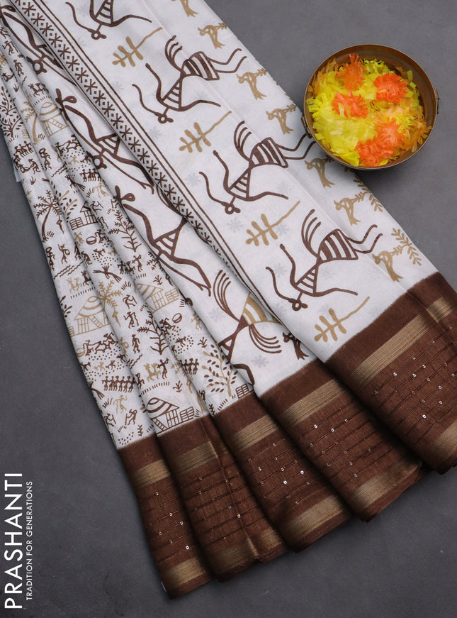 Semi dola saree off white and brown with allover warli prints and zari woven sequin work border