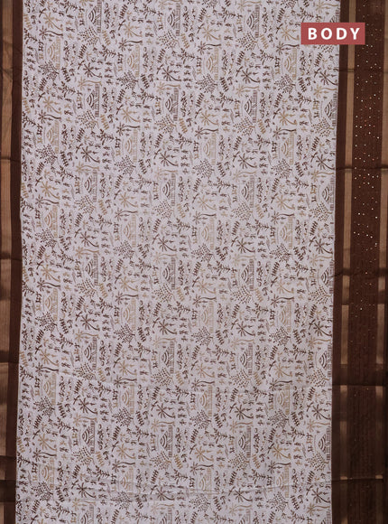 Semi dola saree off white and brown with allover warli prints and zari woven sequin work border