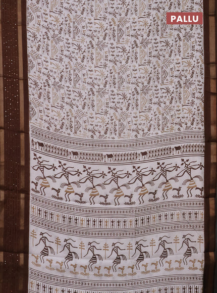 Semi dola saree off white and brown with allover warli prints and zari woven sequin work border