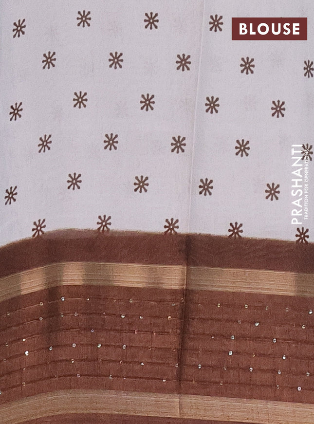 Semi dola saree off white and brown with allover warli prints and zari woven sequin work border