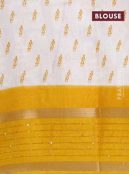 Semi dola saree off white and mustard yellow with allover warli prints and zari woven sequin work border