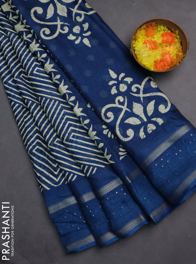 Semi dola saree peacock blue with allover geometric prints and zari woven sequin work border