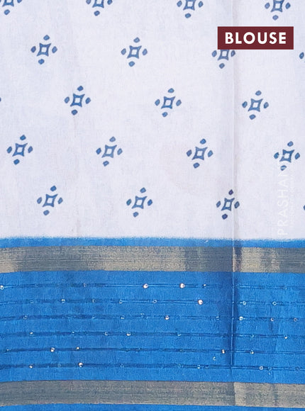 Semi dola saree off white and cs blue with warli prints and zari woven sequin work border