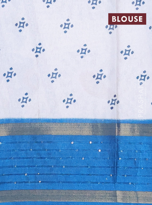 Semi dola saree off white and cs blue with warli prints and zari woven sequin work border