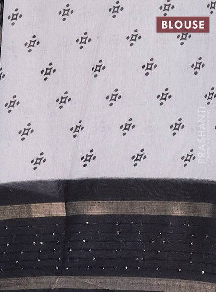 Semi dola saree off white and black with warli prints and zari woven sequin work border