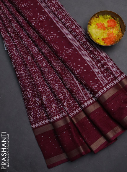 Semi dola saree wine shade with allover warli prints and zari woven sequin work border