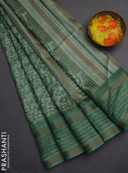Semi dola saree pastel green with allover warli prints and zari woven sequin work border