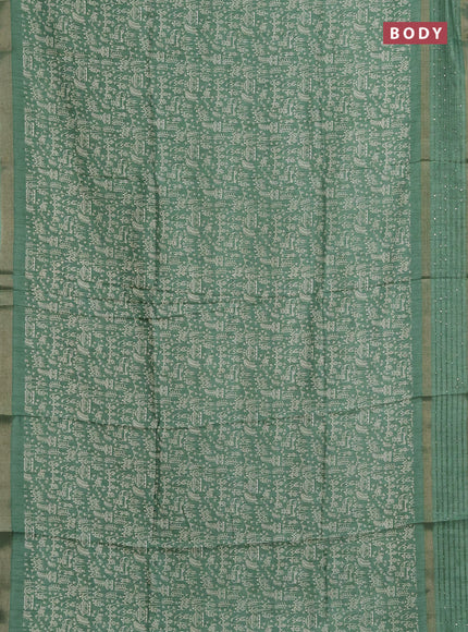 Semi dola saree pastel green with allover warli prints and zari woven sequin work border