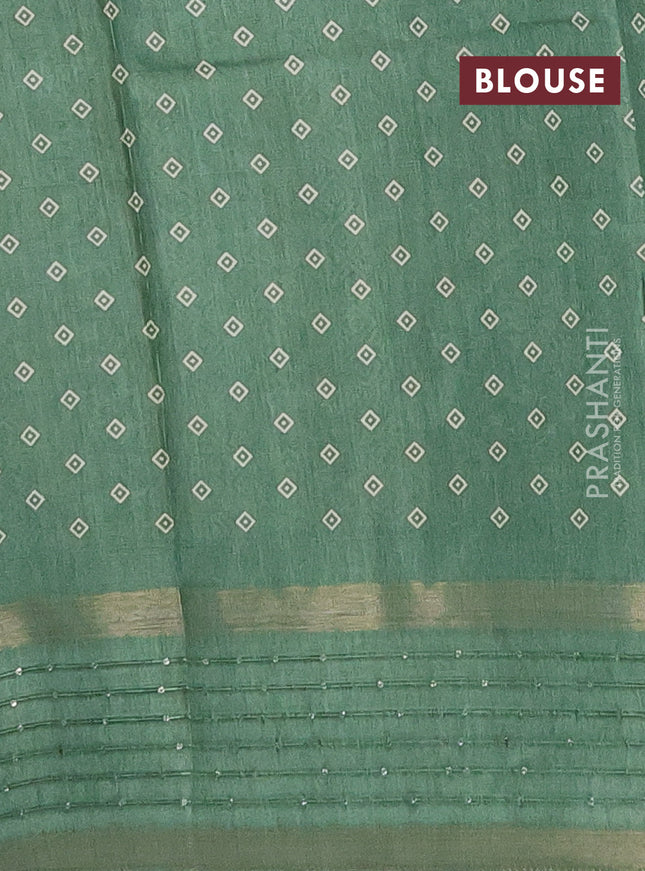 Semi dola saree pastel green with allover warli prints and zari woven sequin work border