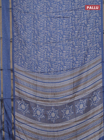 Semi dola saree blue with allover warli prints and zari woven sequin work border