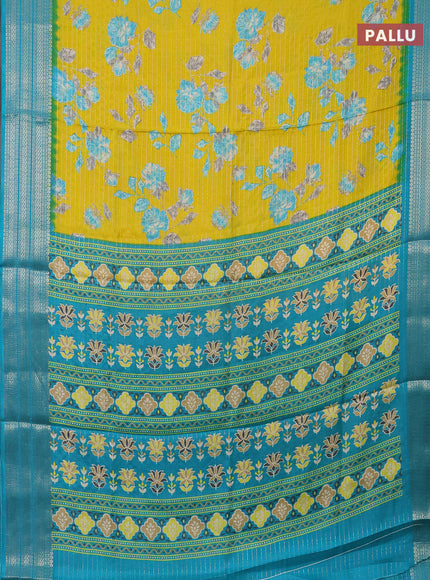 Semi dola saree lime yellow and teal blue with allover zari weaves & floral prints and zari woven border