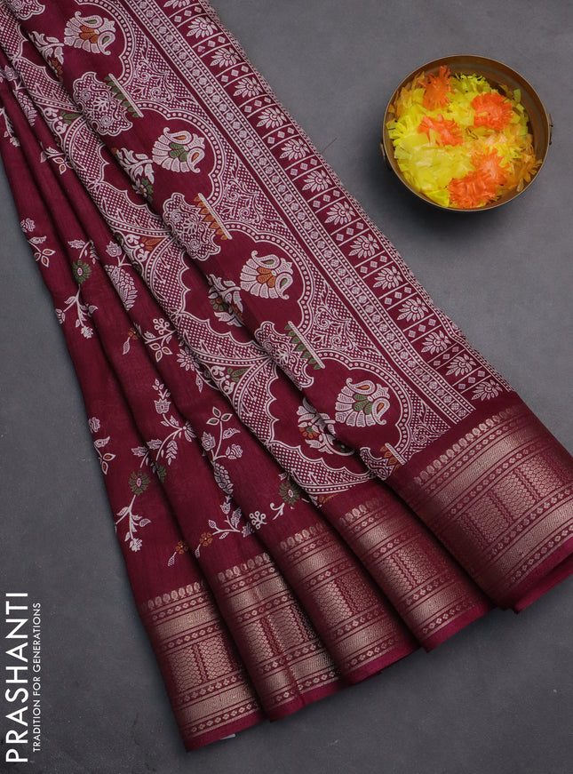 Semi dola saree wine shade with allover prints and zari woven border