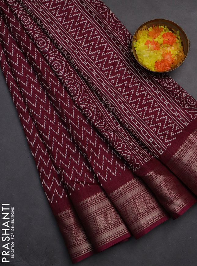 Semi dola saree wine shade with allover zig zag prints and zari woven border