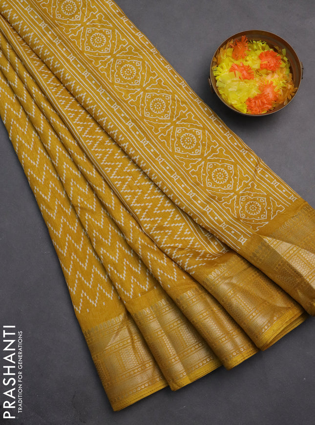 Semi dola saree yellow with allover zig zag prints and zari woven border