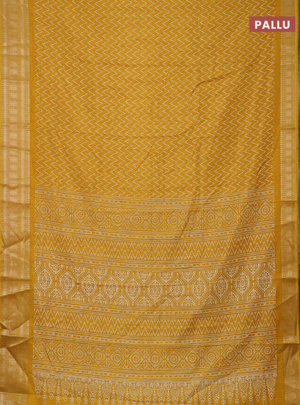 Semi dola saree yellow with allover zig zag prints and zari woven border