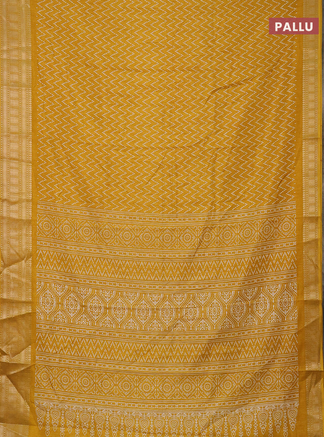 Semi dola saree yellow with allover zig zag prints and zari woven border