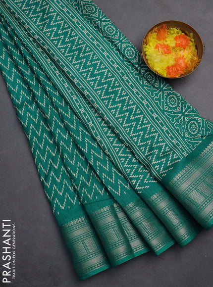 Semi dola saree teal blue with allover zig zag prints and zari woven border