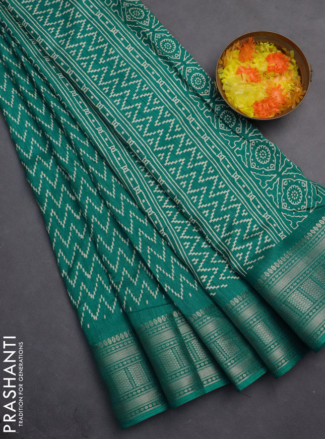 Semi dola saree teal blue with allover zig zag prints and zari woven border
