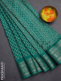 Semi dola saree teal blue with allover zig zag prints and zari woven border