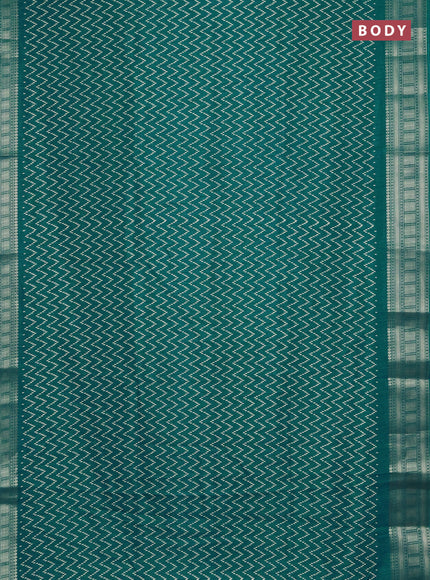 Semi dola saree teal blue with allover zig zag prints and zari woven border