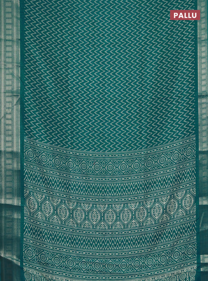 Semi dola saree teal blue with allover zig zag prints and zari woven border