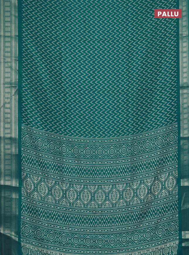 Semi dola saree teal blue with allover zig zag prints and zari woven border