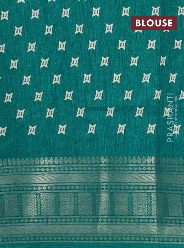 Semi dola saree teal blue with allover zig zag prints and zari woven border