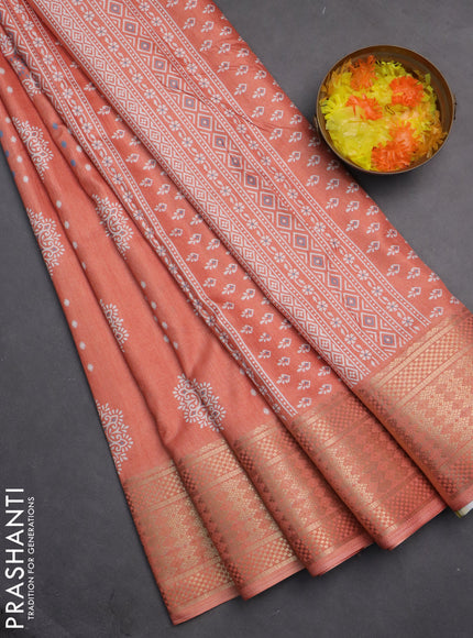 Semi dola saree peach orange with butta prints and zari woven border