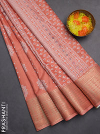 Semi dola saree peach orange with butta prints and zari woven border
