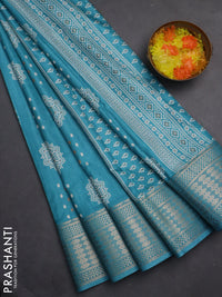 Semi dola saree teal blue with butta prints and zari woven border