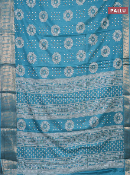 Semi dola saree teal blue with butta prints and zari woven border
