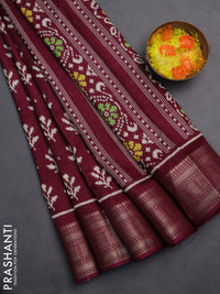 Semi dola saree wine shade with allover ikat butta prints and zari woven border