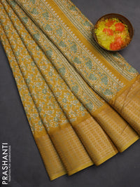 Semi dola saree mustard yellow with allover prints and zari woven border