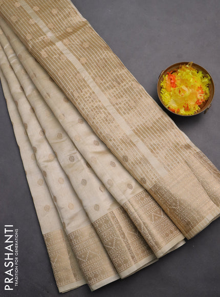 Semi raw silk saree cream with allover zari woven 1000 buttas and zari woven border