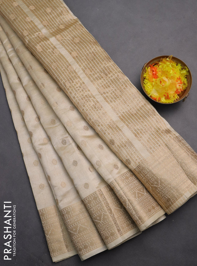 Semi raw silk saree cream with allover zari woven 1000 buttas and zari woven border
