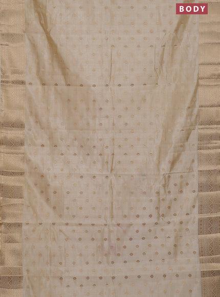 Semi raw silk saree cream with allover zari woven 1000 buttas and zari woven border