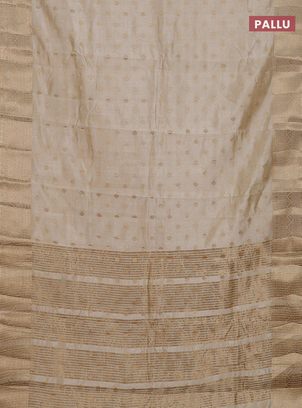 Semi raw silk saree cream with allover zari woven 1000 buttas and zari woven border