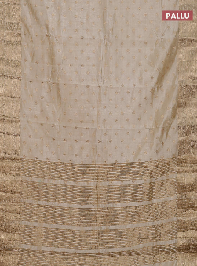 Semi raw silk saree cream with allover zari woven 1000 buttas and zari woven border