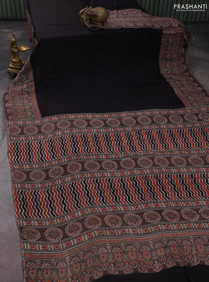 Modal silk saree black and brown with plain body and ajrakh printed border & pallu
