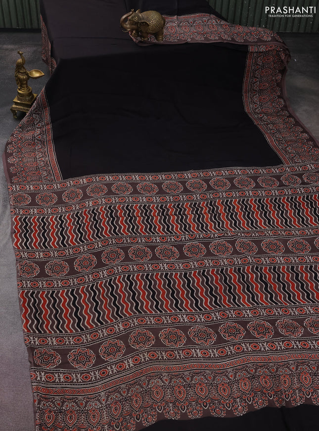 Modal silk saree black and brown with plain body and ajrakh printed border & pallu
