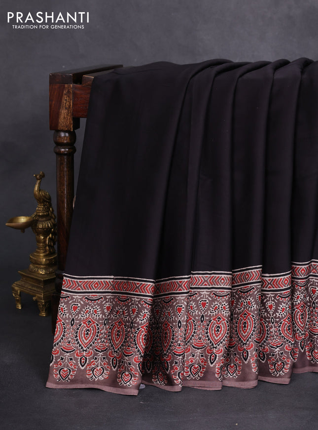 Modal silk saree black and pastel brown with plain body and ajrakh printed pallu & blouse