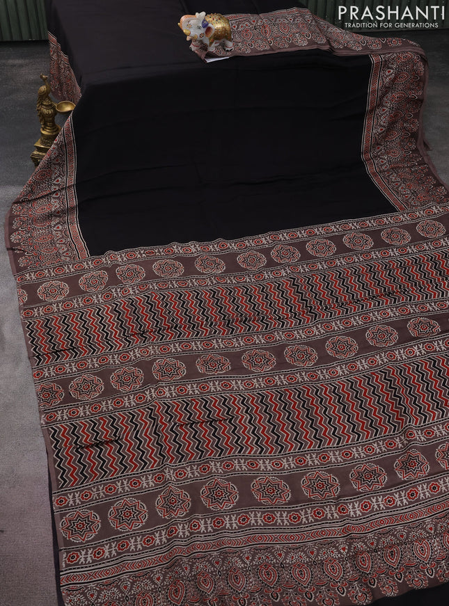 Modal silk saree black and pastel brown with plain body and ajrakh printed pallu & blouse