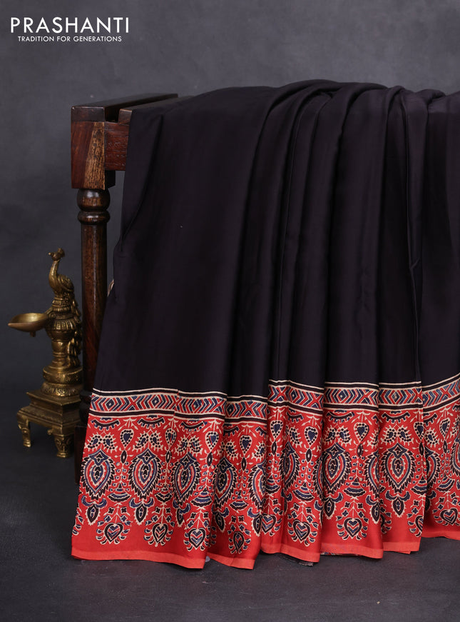 Modal silk saree black and orange with plain body and ajrakh printed pallu & blouse