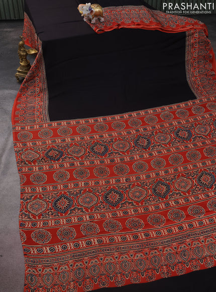 Modal silk saree black and orange with plain body and ajrakh printed pallu & blouse