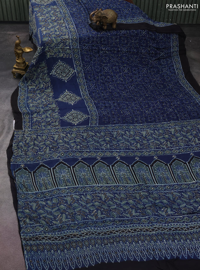 Modal silk saree blue and black with allover ajrakh prints and printed border