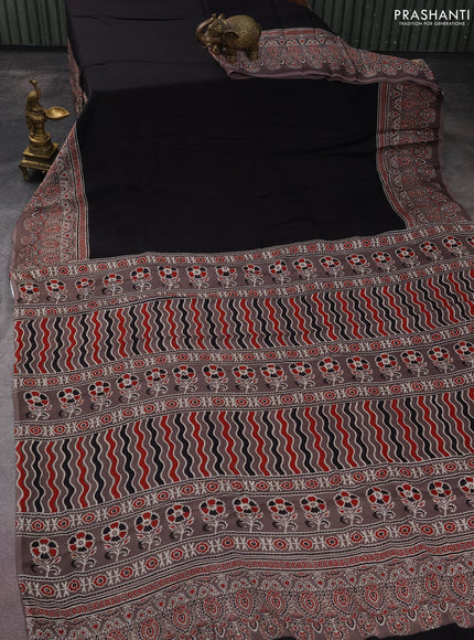 Modal silk saree black and grey with plain body and ajrakh printed border & pallu