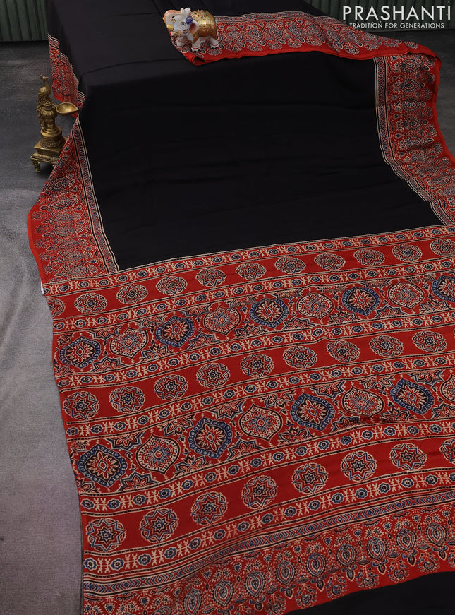 Modal silk saree black and red with plain body and ajrakh printed pallu & blouse