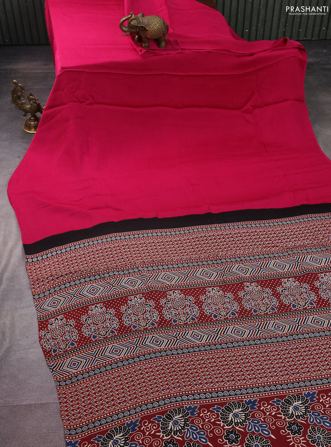 Modal silk saree pink and maroon with plain body and ajrakh printed pallu & blouse