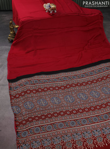 Modal silk saree dark pink and maroon with plain body and ajrakh printed pallu & blouse