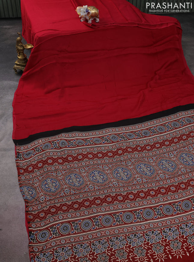 Modal silk saree dark pink and maroon with plain body and ajrakh printed pallu & blouse